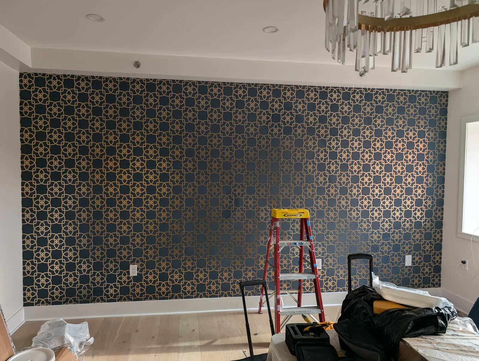 Metallic gold lattice geometric wallpaper in a dining salon