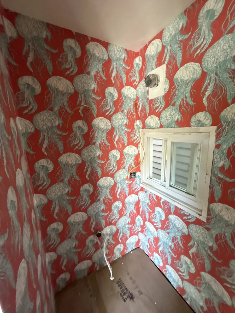 Luxury powder room — red coral and marine designer wallpaper