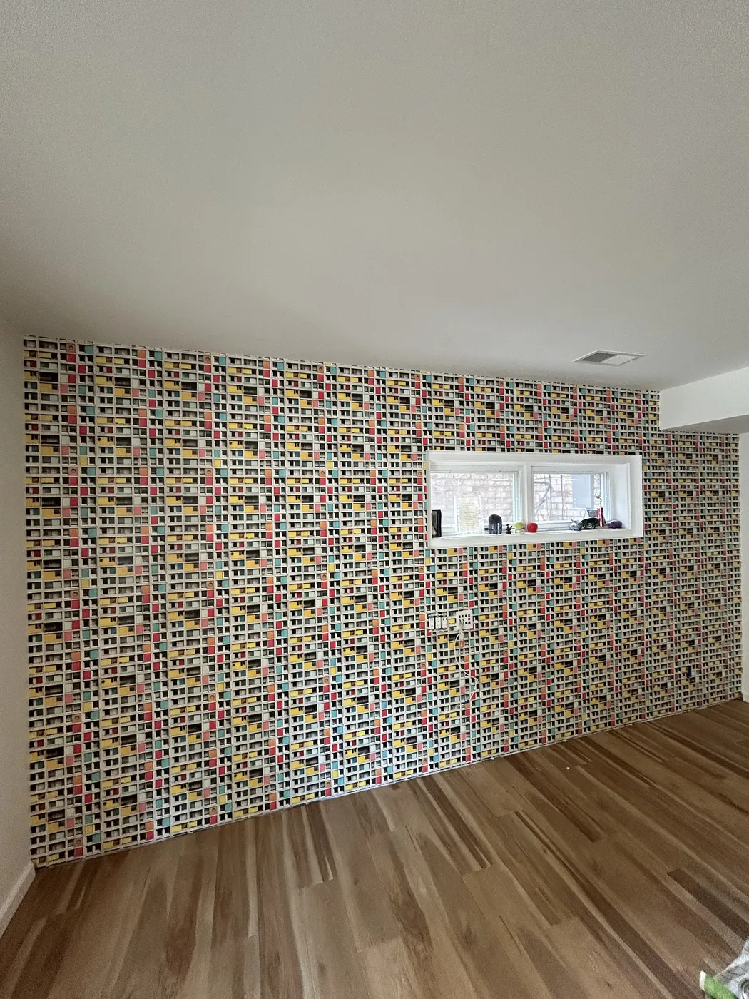 Colorful mosaic pattern wallpaper on an accent wall — wallpaper installation by ProKir Design