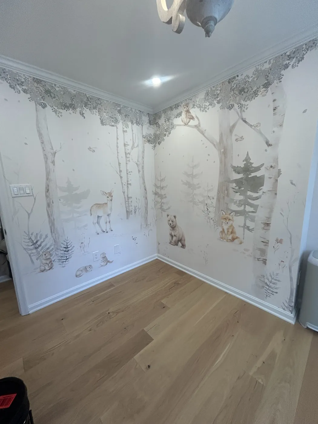 Woodland birch forest mural with animals in a nursery — wallpaper installation by ProKir Design