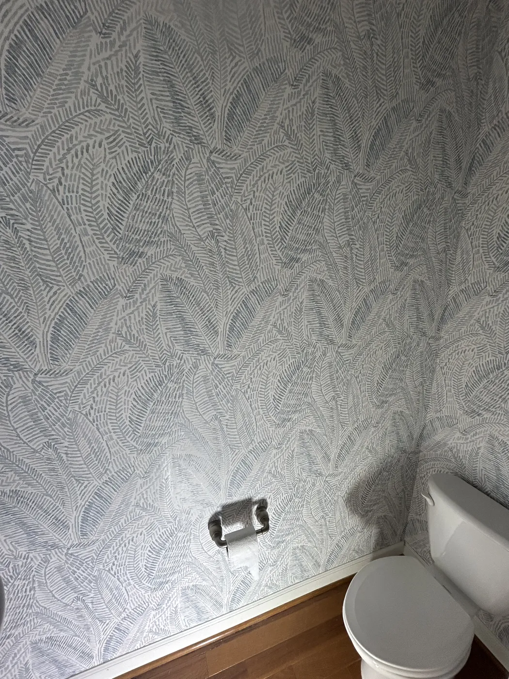 Fine fern leaf wallpaper in a bathroom — wallpaper installation by ProKir Design