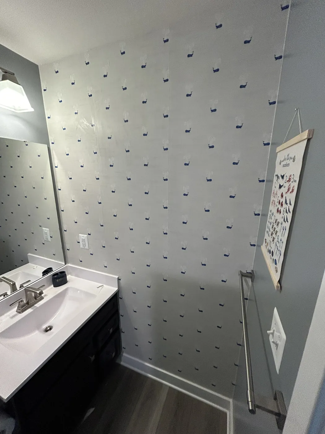 Navy dot wallpaper in a bathroom — wallpaper installation by ProKir Design