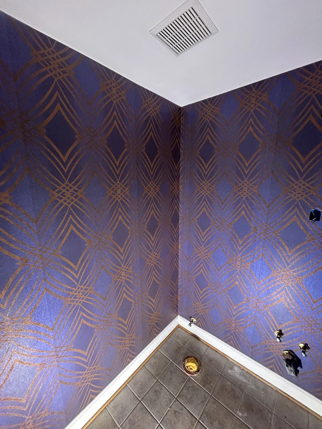 Plum and gold Art Deco wallpaper in a powder room — wallpaper installation by ProKir Design