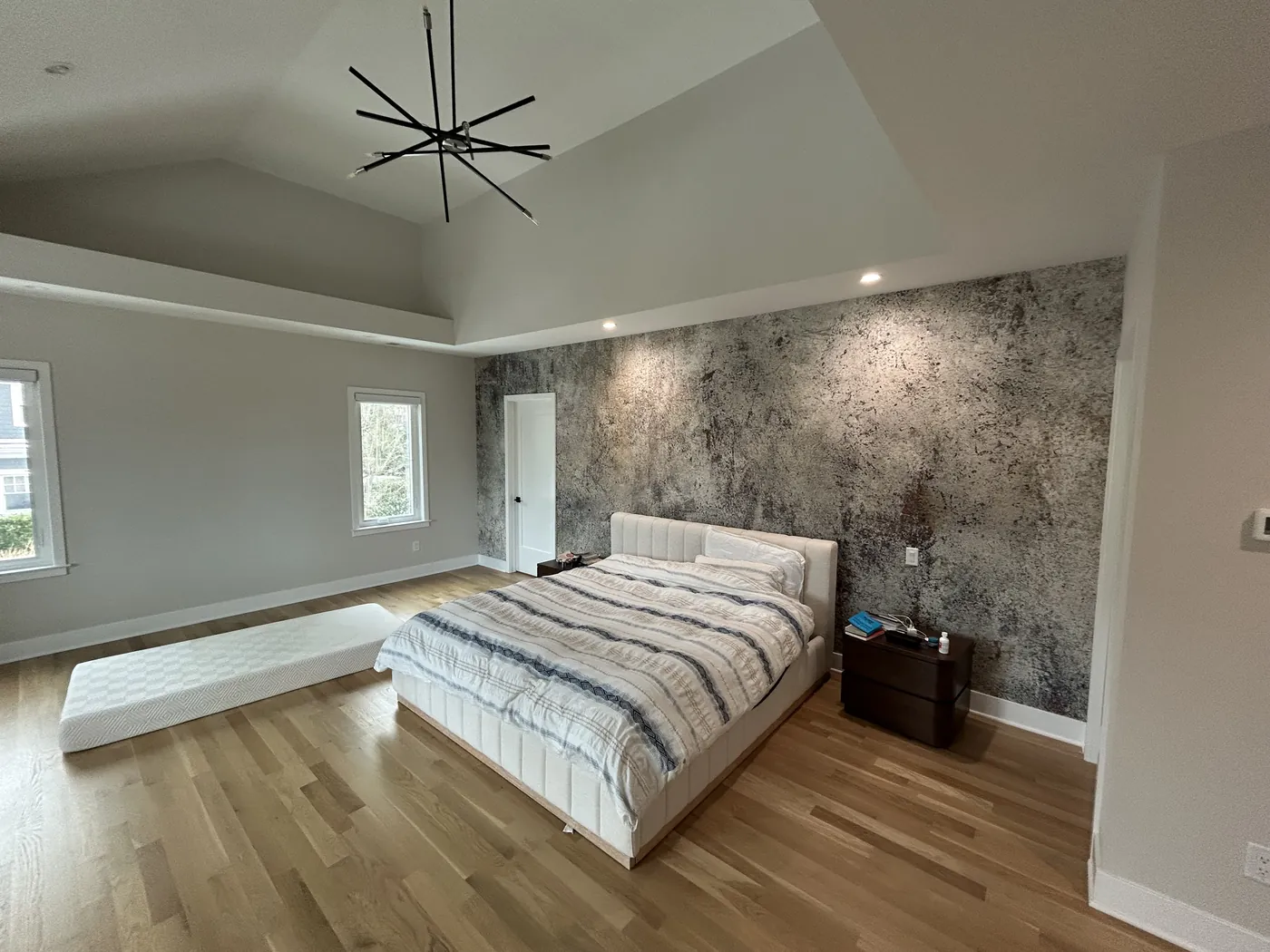 Botanical feature wall behind a bed — wallpaper installation by ProKir Design