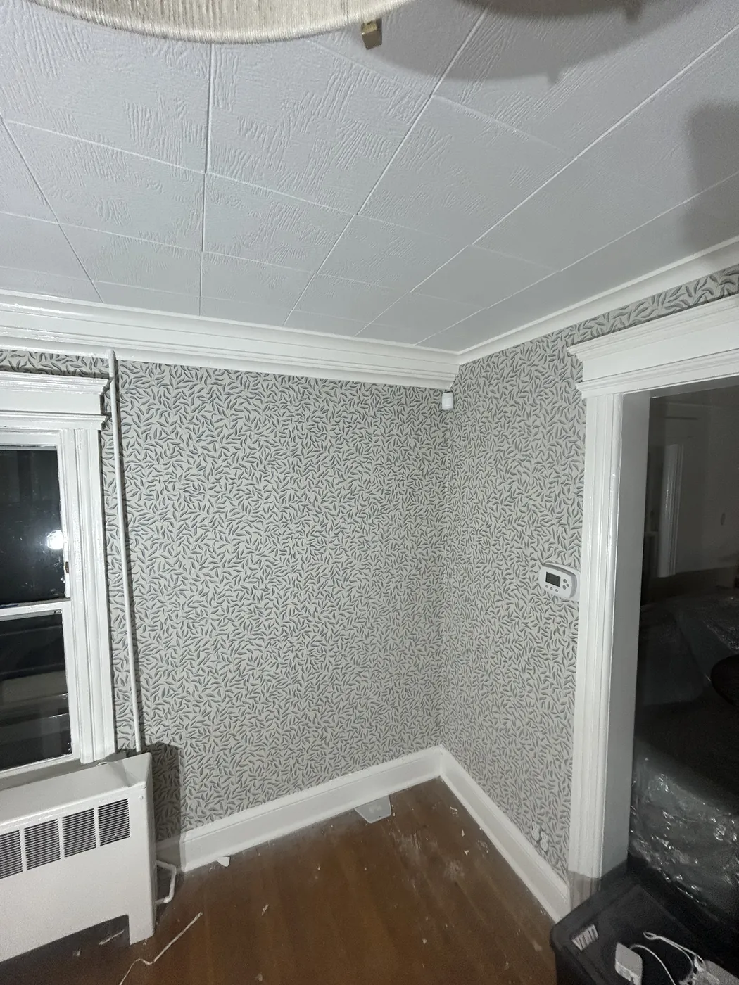Small sprig pattern wallpaper in a foyer — wallpaper installation by ProKir Design