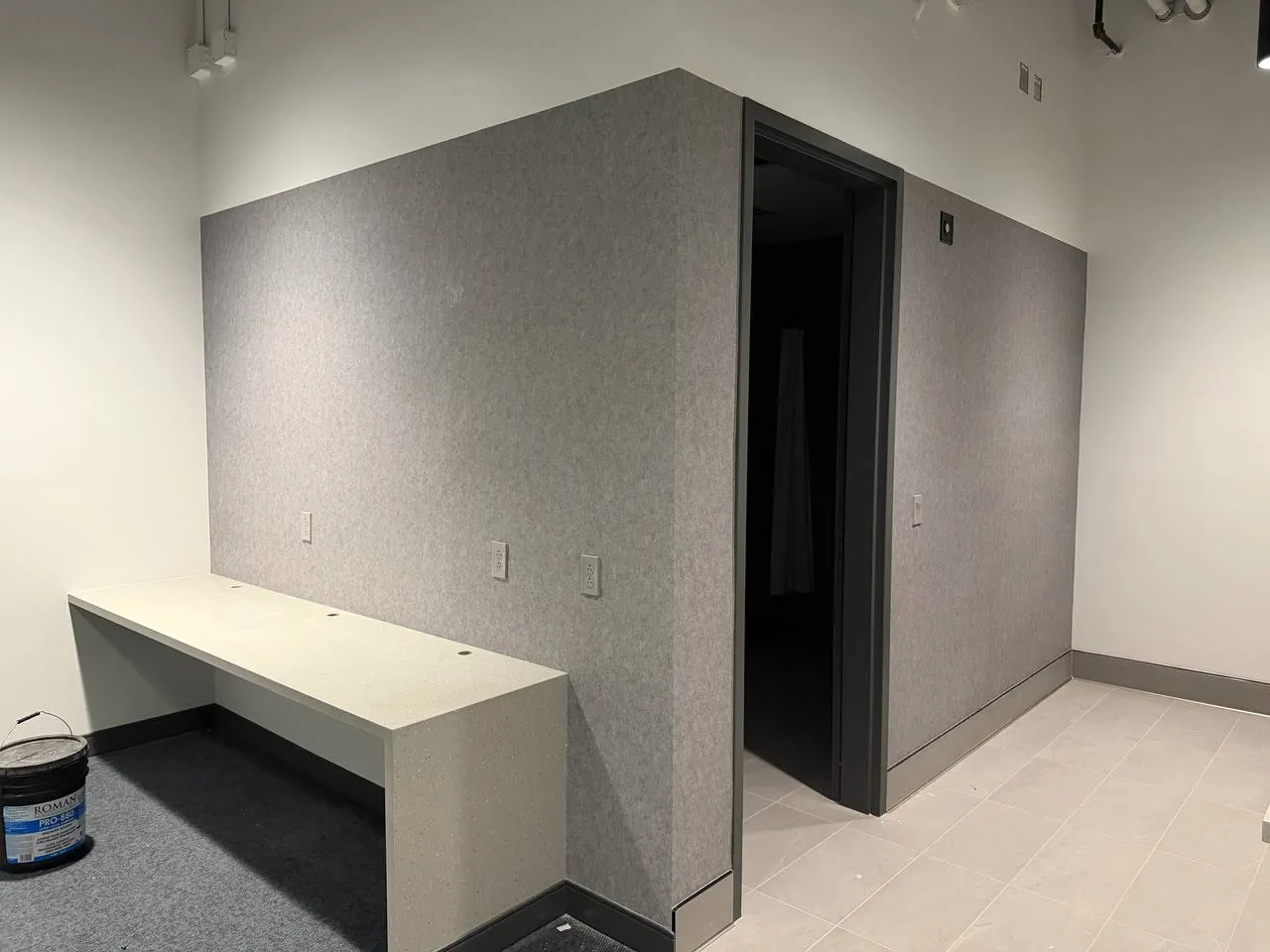 Grey textile wallcovering in an office — wallpaper installation by ProKir Design
