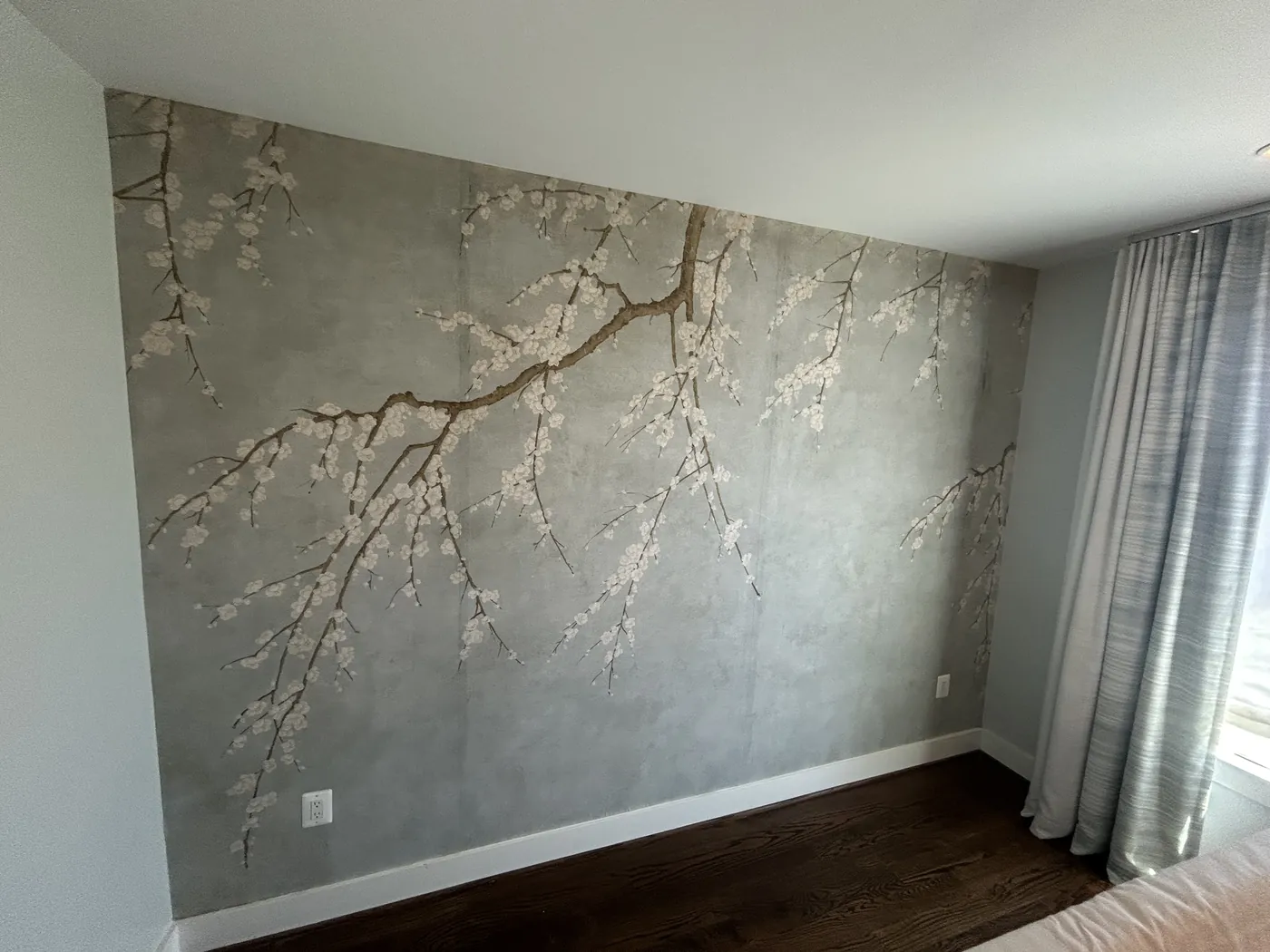 Blossom branch mural on a bedroom wall — wallpaper installation by ProKir Design