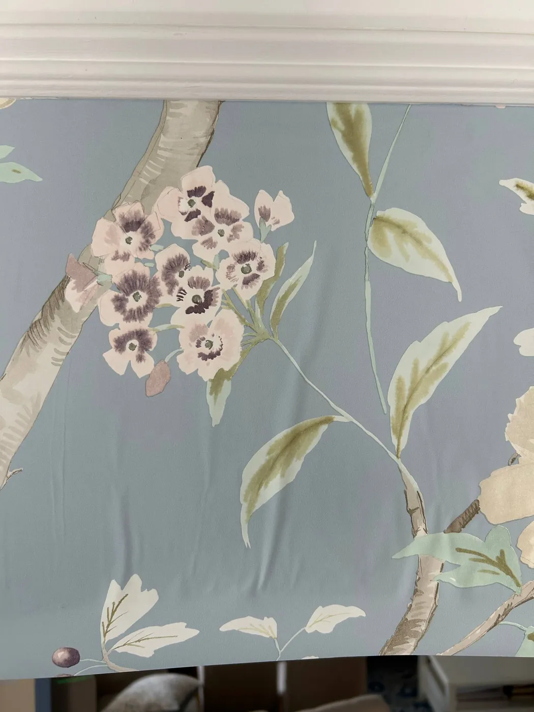 Close-up of a hand-painted floral wallcovering — wallpaper installation by ProKir Design