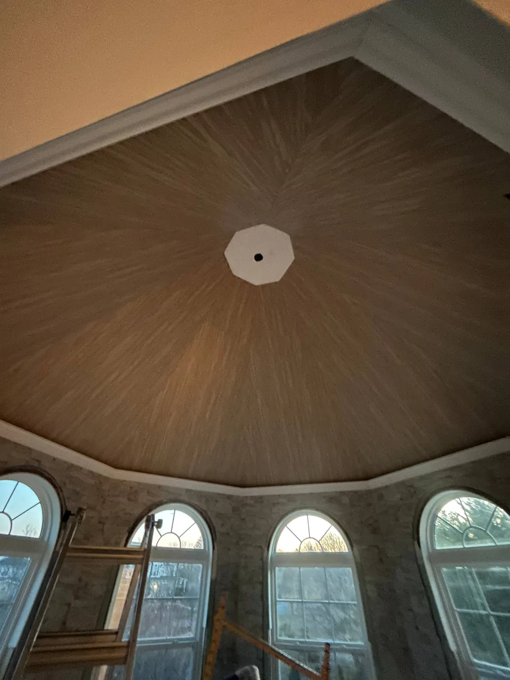 Wallcovering on a domed rotunda ceiling above arched windows — wallpaper installation by ProKir Design