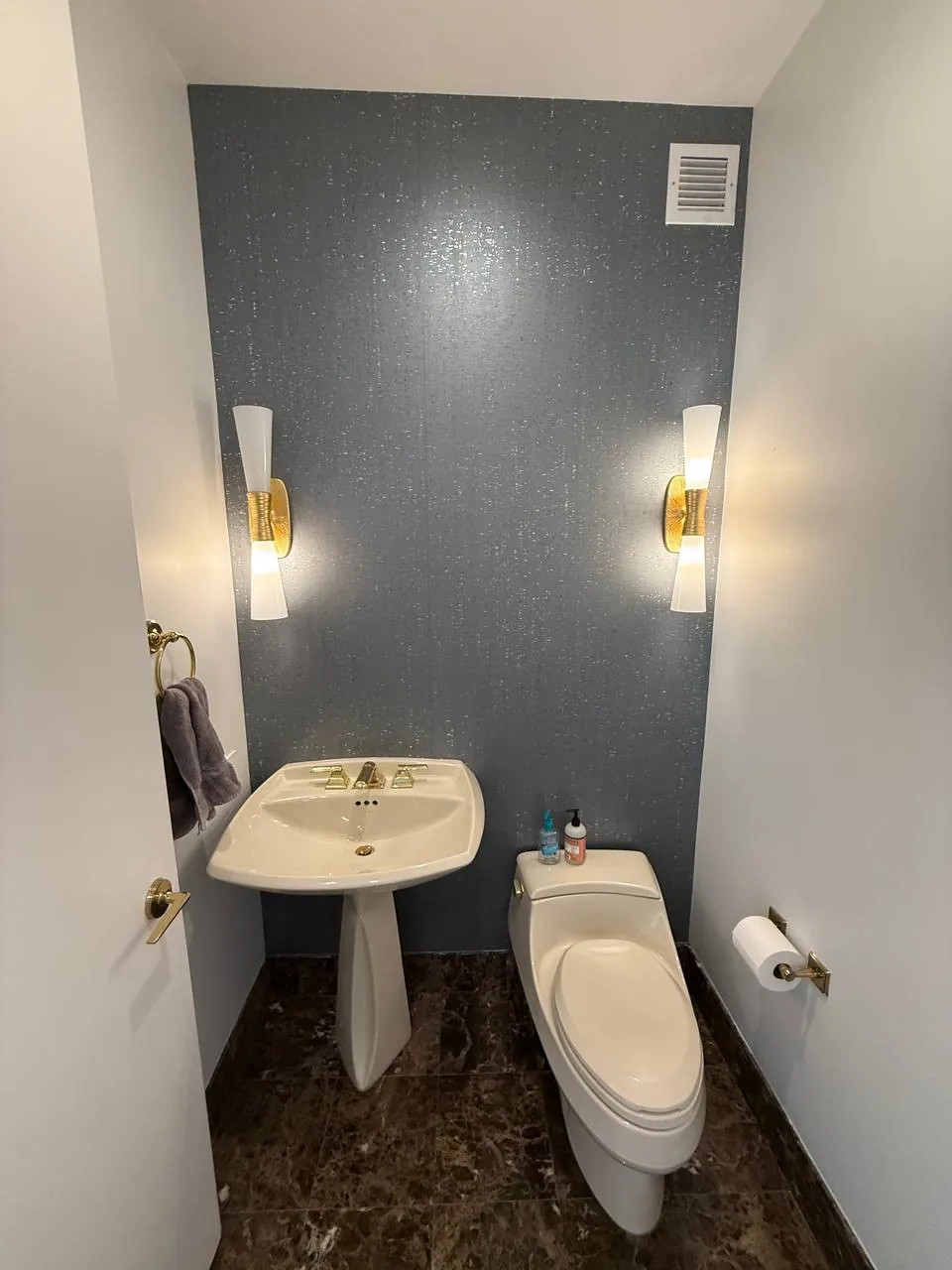 Shimmer textured wallcovering in a powder room — wallpaper installation by ProKir Design