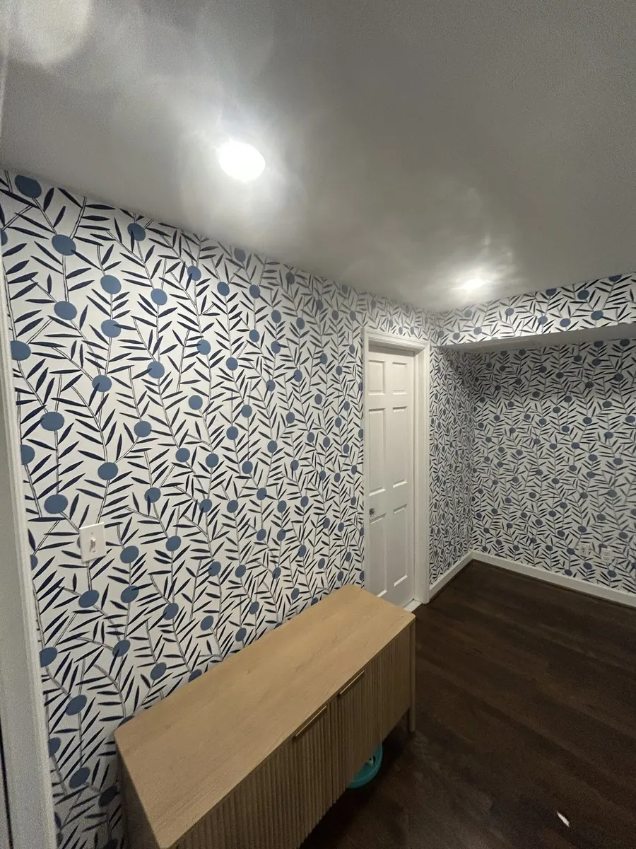 Modern home office — Scandinavian blue leaf wallpaper installation