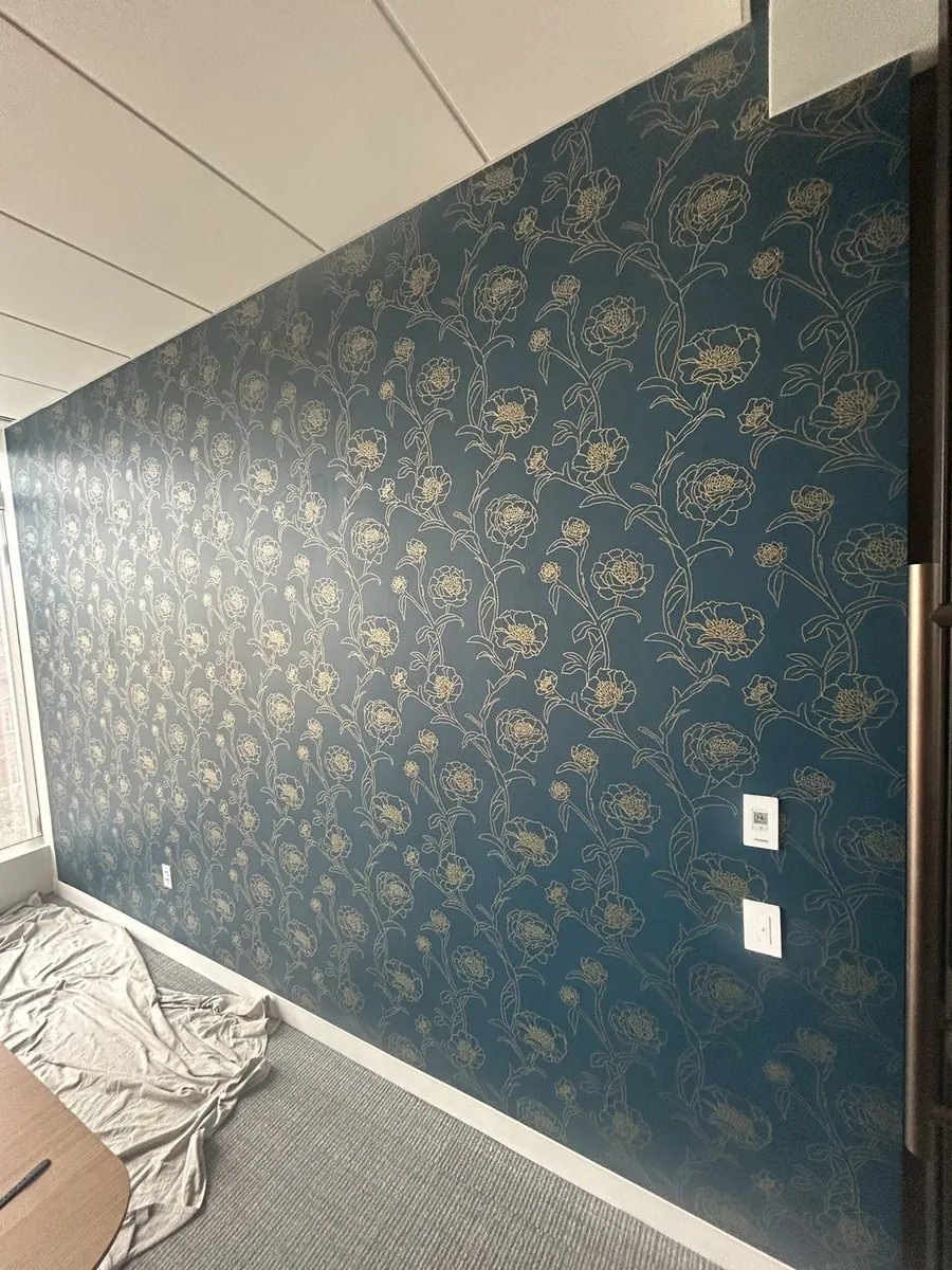 Luxury residential wallpaper installation — midnight navy and gold damask master suite