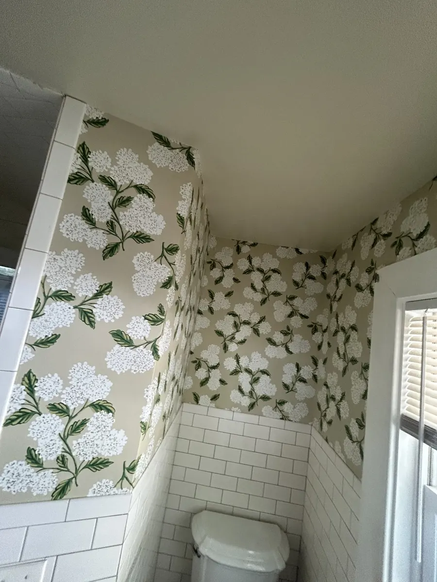 Master bath — botanical floral wallpaper with precision molding cutouts