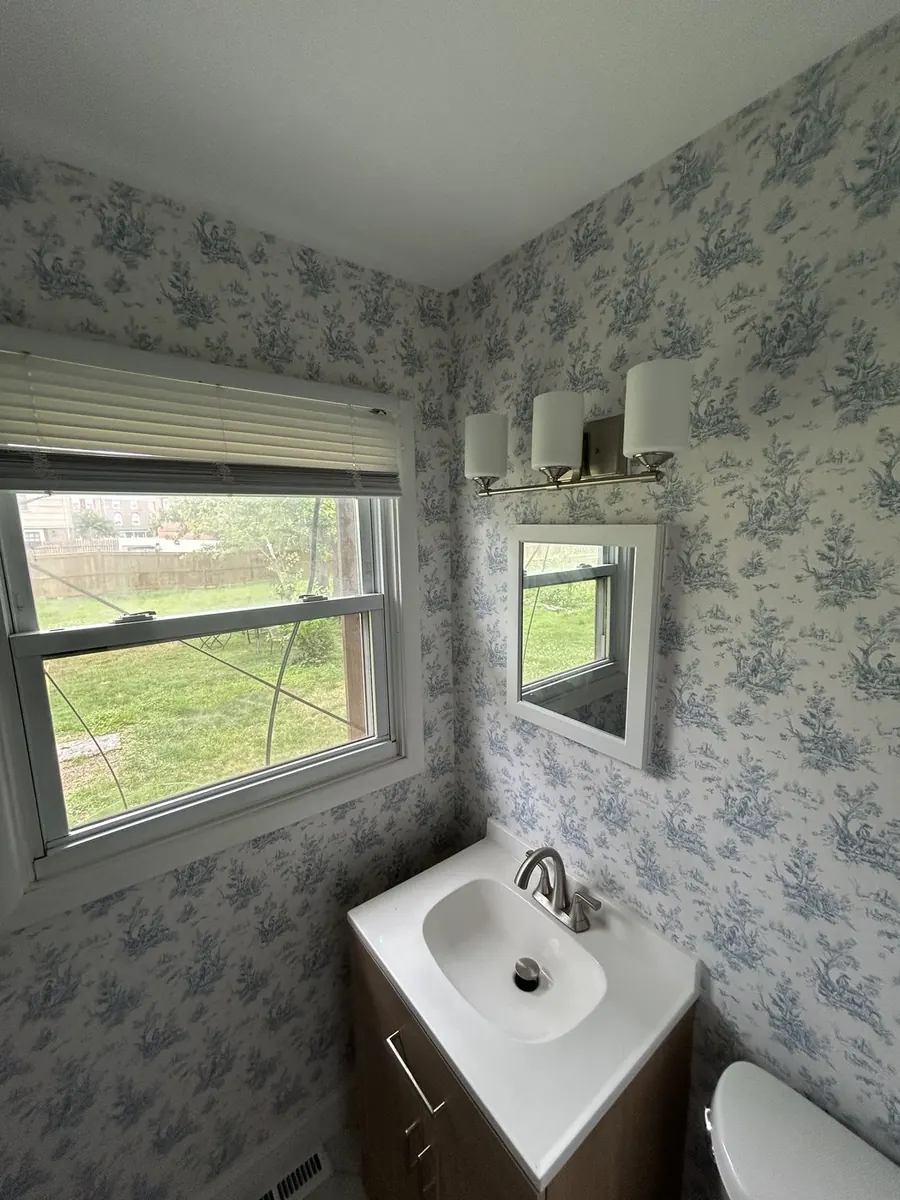 Guest powder room — classic blue botanical toile wallcovering
