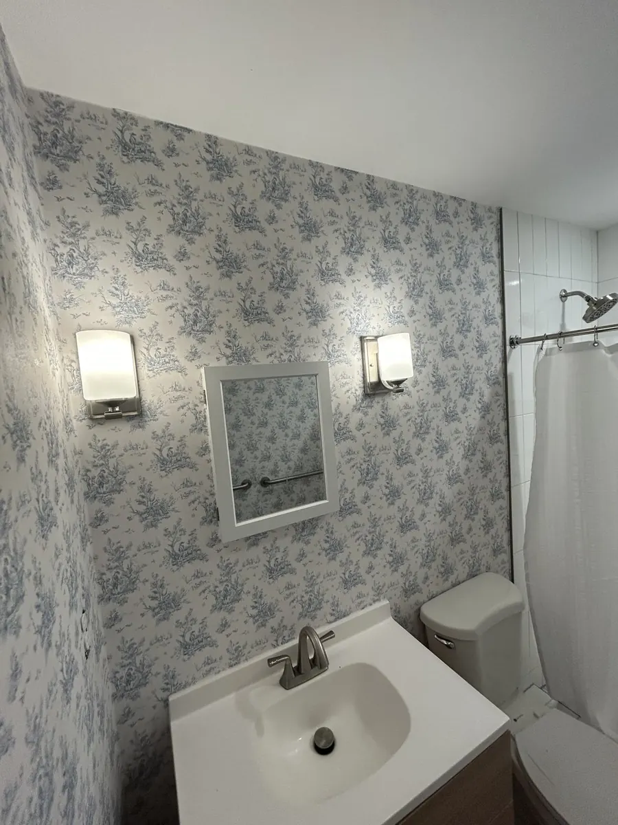 Phillip Jeffries metallic textured wallcovering in a bedroom — wallpaper installation by ProKir Design, serving DUMBO Brooklyn