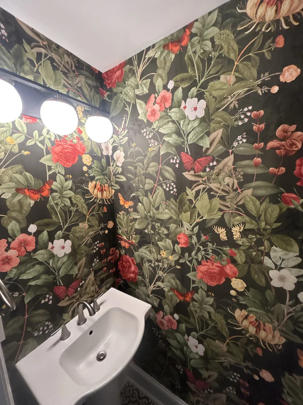Dark rose and botanical wallpaper in a powder room — wallpaper installation by ProKir Design