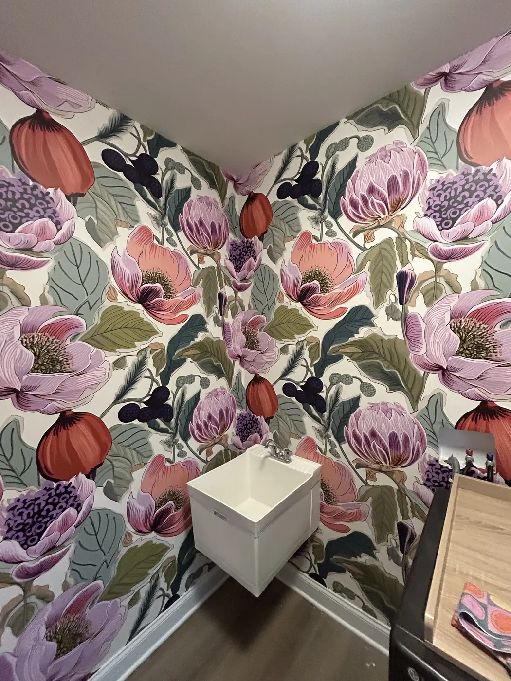 Painterly protea floral wallpaper in a powder room — wallpaper installation by ProKir Design