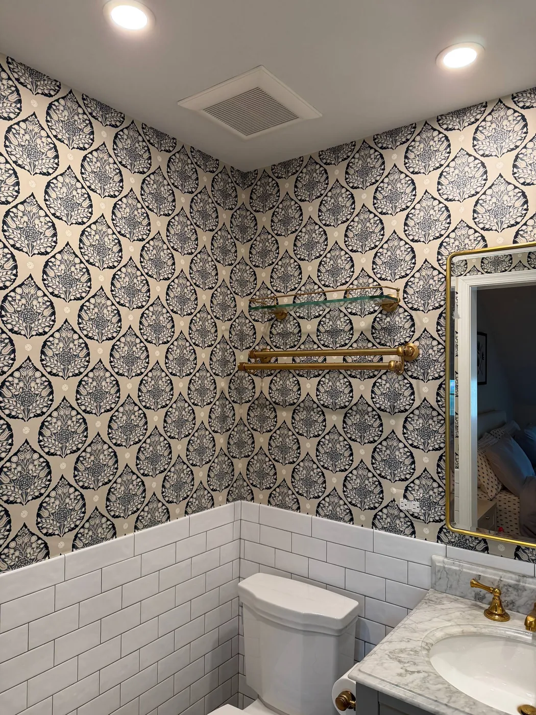 Navy damask wallpaper above white subway tile — wallpaper installation by ProKir Design
