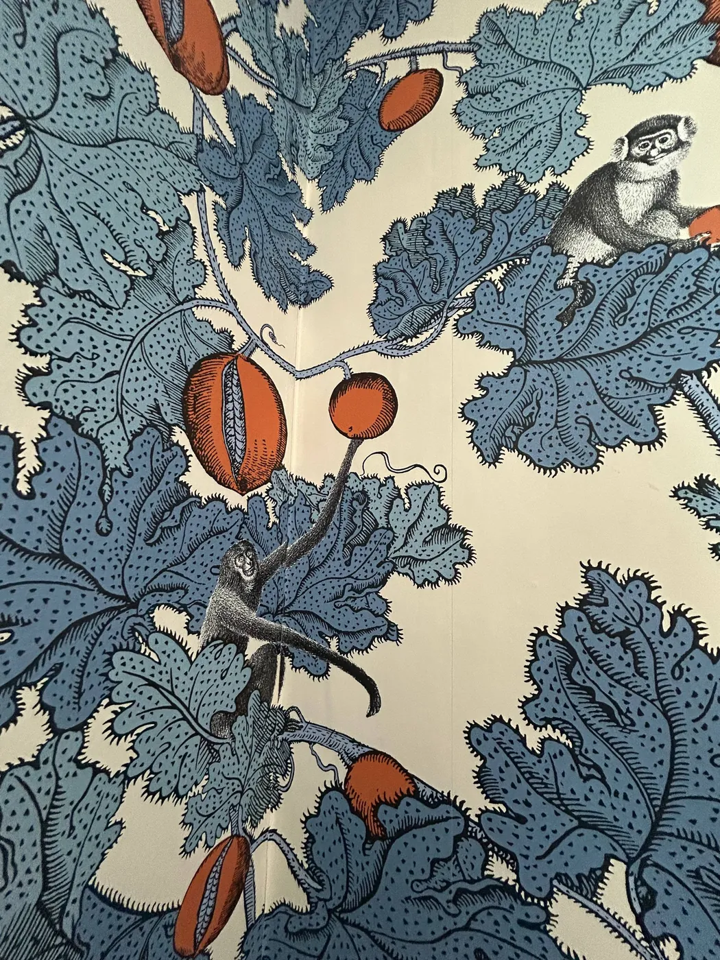 Close-up of a seamless pattern match on oak and monkey wallpaper — wallpaper installation by ProKir Design