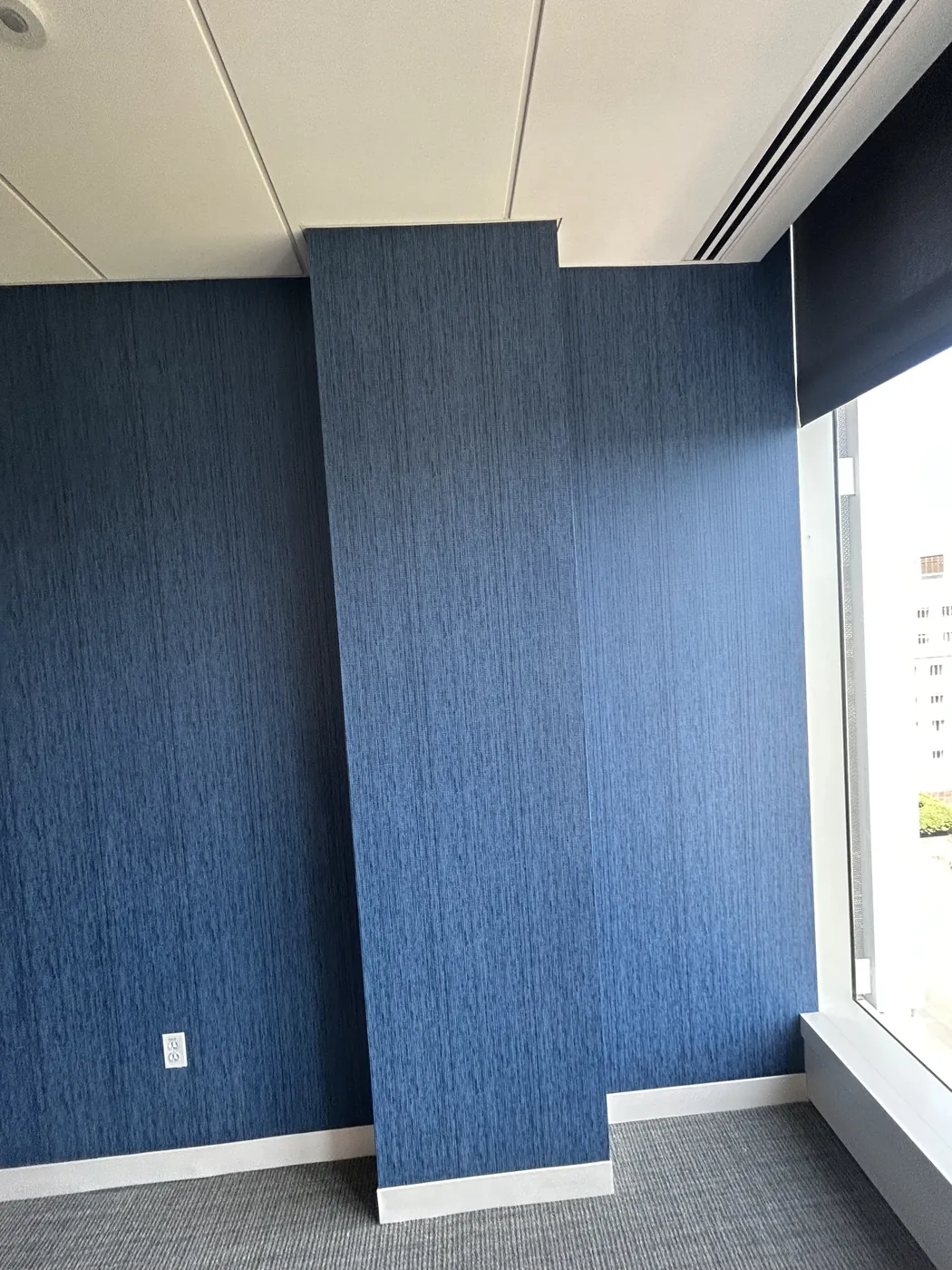 Navy grasscloth wallcovering in a corporate office — wallpaper installation by ProKir Design