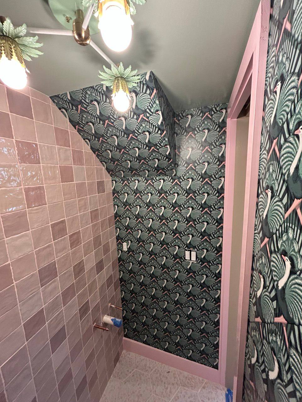 Another angle of bird wallpaper with pink tile