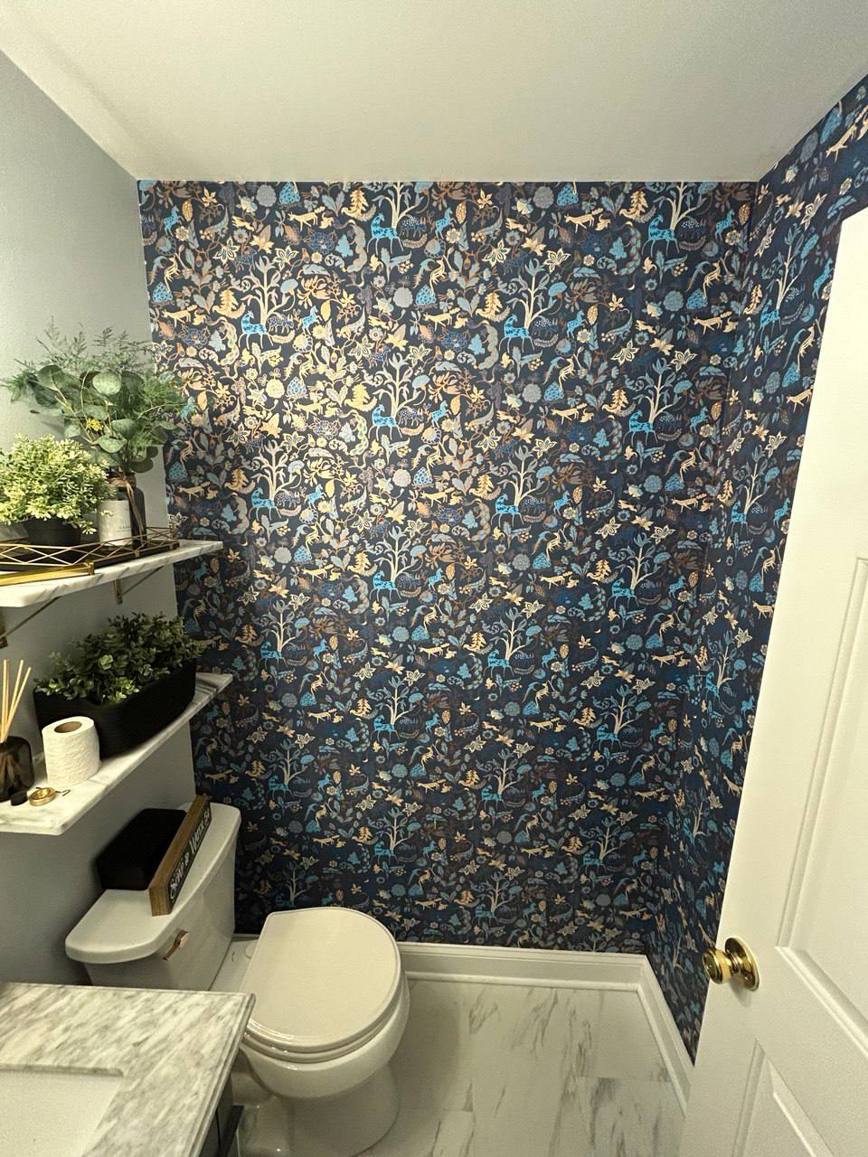 Residential wallpaper installation — intricate blue and gold pattern