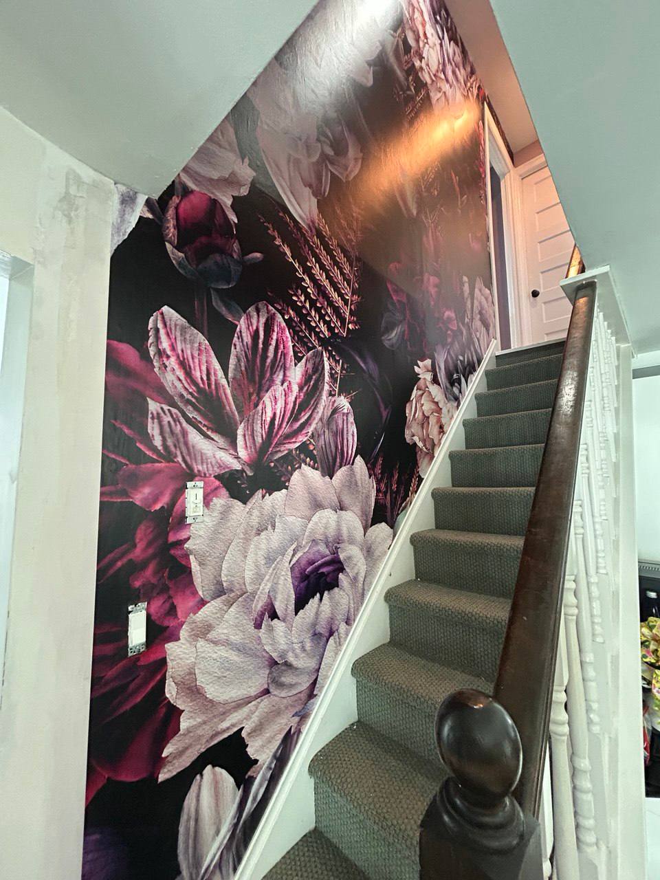Large-scale floral mural on stairwell