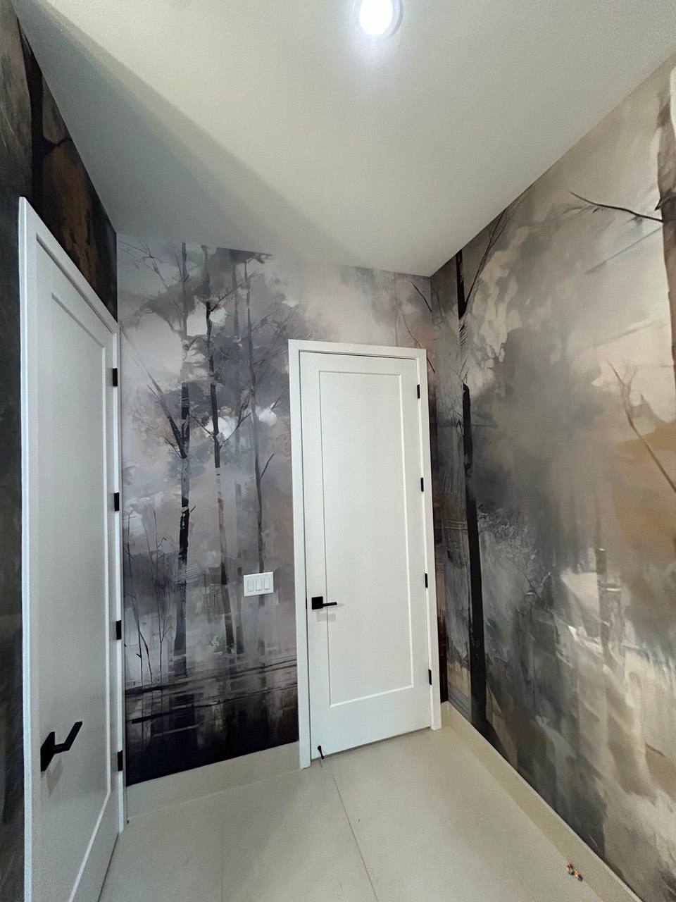 Atmospheric forest mural wallpaper in hallway
